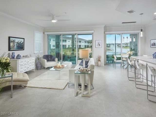 living room featuring visible vents, light tile patterned flooring, ceiling fan, and crown molding