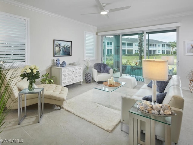 living room featuring crown molding and a ceiling fan