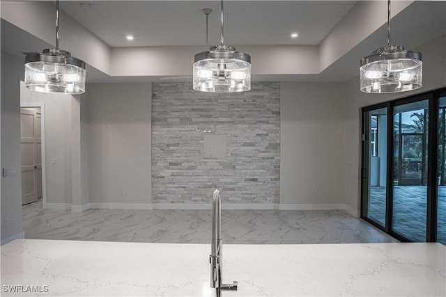 unfurnished dining area with recessed lighting, marble finish floor, and baseboards