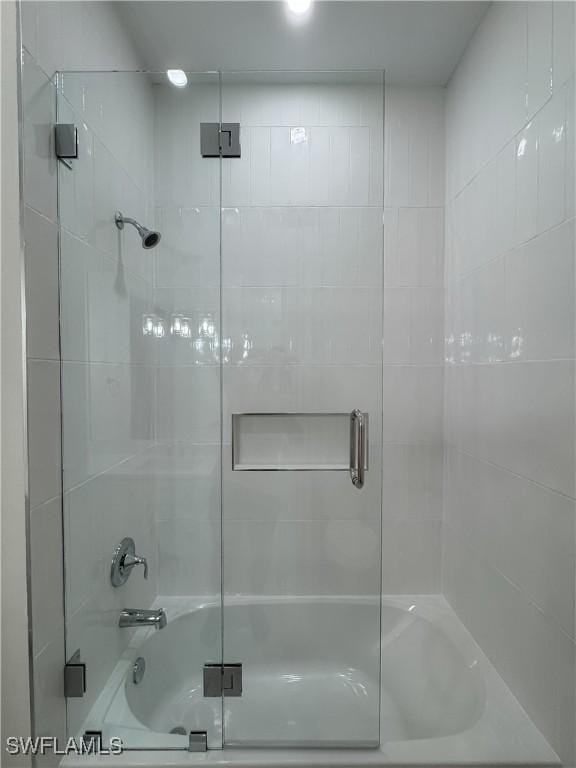 full bath with shower / bath combination with glass door