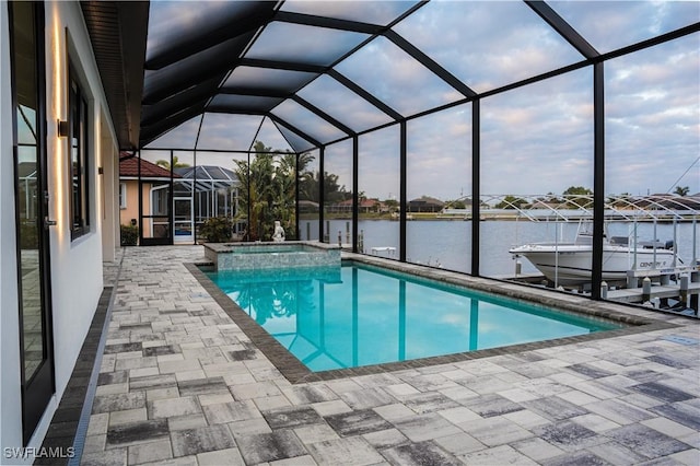 view of swimming pool with a patio, boat lift, a lanai, a water view, and a dock