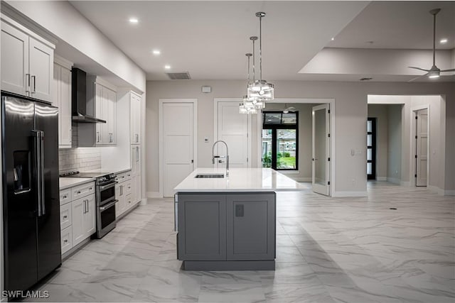 kitchen with high end black refrigerator, visible vents, marble finish floor, double oven range, and wall chimney exhaust hood