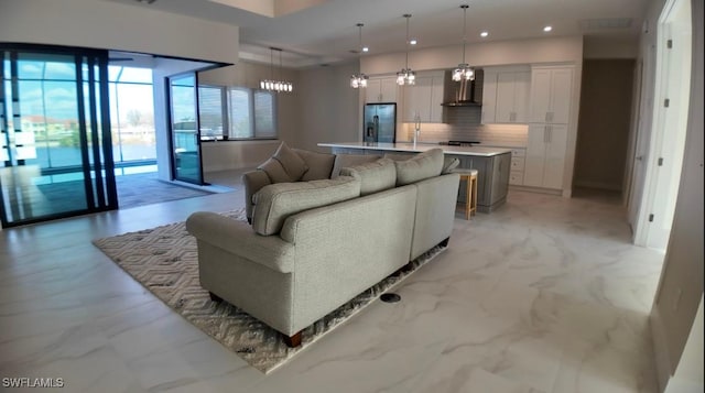 living room featuring marble finish floor and recessed lighting