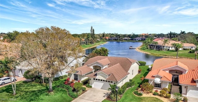 birds eye view of property featuring a water view