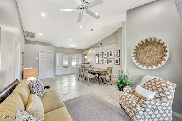 living area featuring visible vents, tile patterned flooring, ceiling fan with notable chandelier, high vaulted ceiling, and recessed lighting