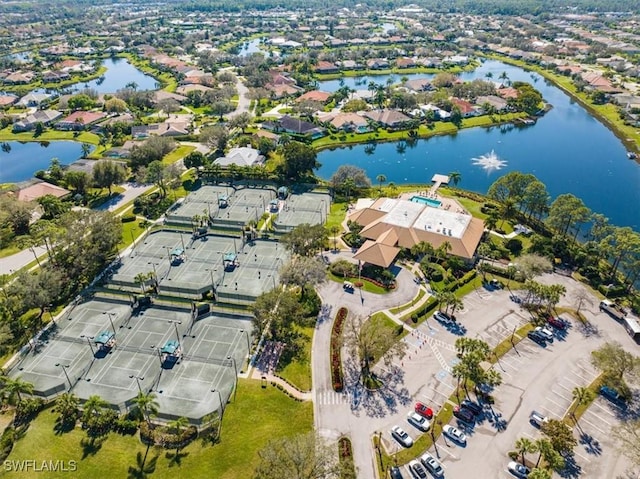 bird's eye view with a residential view and a water view