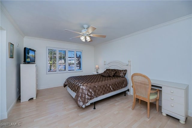 bedroom with ornamental molding, light wood-style flooring, baseboards, and a ceiling fan