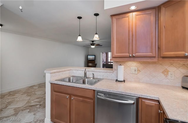 kitchen featuring dishwasher, tasteful backsplash, ceiling fan, and a sink