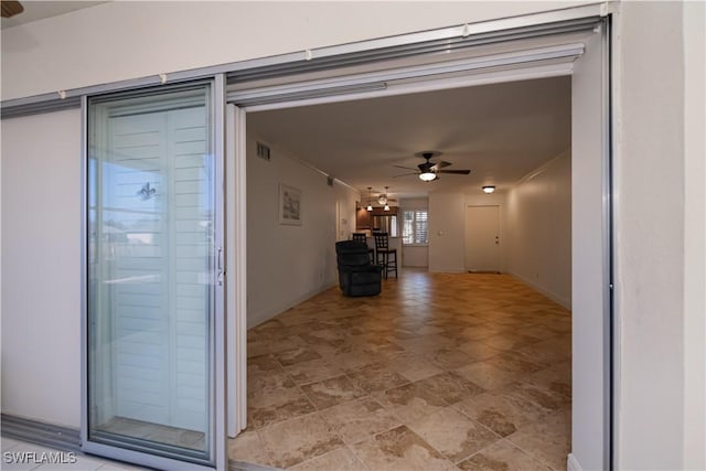 hallway featuring baseboards