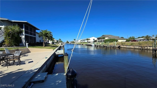 dock area with a water view and a residential view