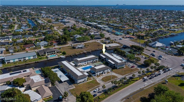 aerial perspective of suburban area featuring a nearby body of water