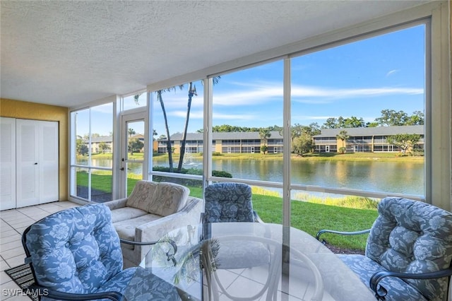 sunroom / solarium with a wealth of natural light and a water view