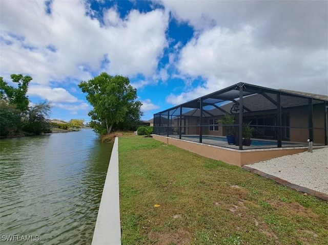 exterior space featuring a water view, a lanai, and an outdoor pool