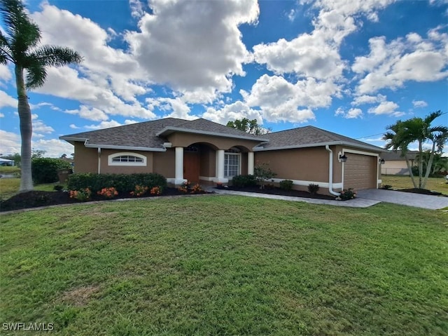 view of front of property with driveway, a front yard, an attached garage, and stucco siding