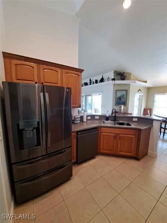 kitchen featuring black dishwasher, light tile patterned floors, a sink, refrigerator with ice dispenser, and a peninsula