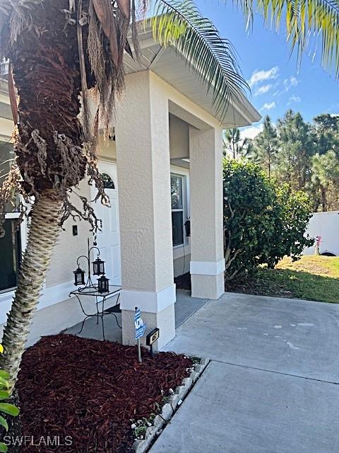 view of property exterior with a patio area and stucco siding