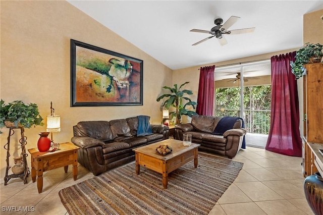 living room with lofted ceiling, ceiling fan, and light tile patterned floors