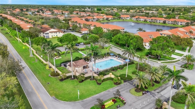 bird's eye view with a residential view and a water view