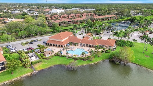 drone / aerial view with a water view and a residential view