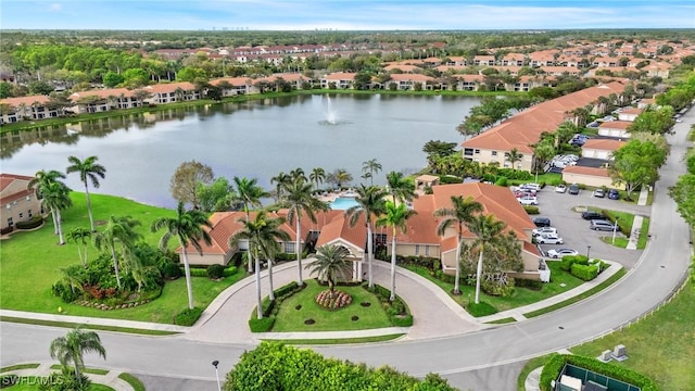 bird's eye view featuring a water view and a residential view