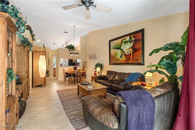 living area featuring ceiling fan, visible vents, vaulted ceiling, and light tile patterned flooring