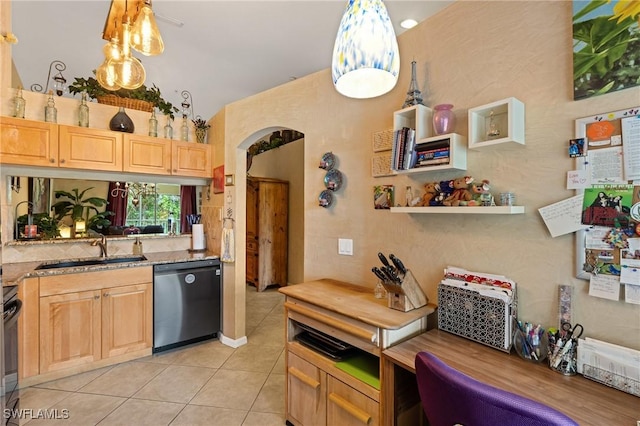 kitchen featuring light tile patterned floors, dishwashing machine, light brown cabinetry, and a sink