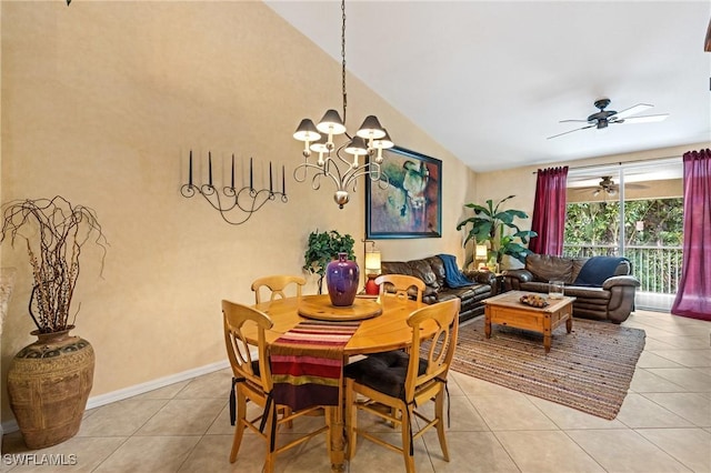 dining area featuring light tile patterned floors, baseboards, high vaulted ceiling, and ceiling fan with notable chandelier