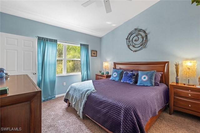 bedroom featuring lofted ceiling, ceiling fan, baseboards, and carpet flooring