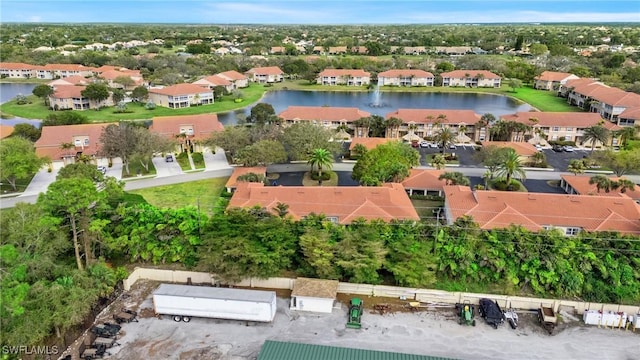 bird's eye view featuring a residential view and a water view