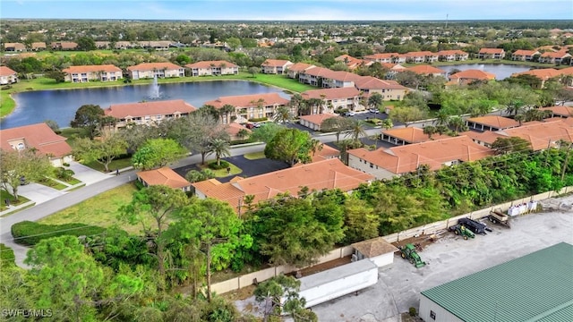 bird's eye view with a water view and a residential view