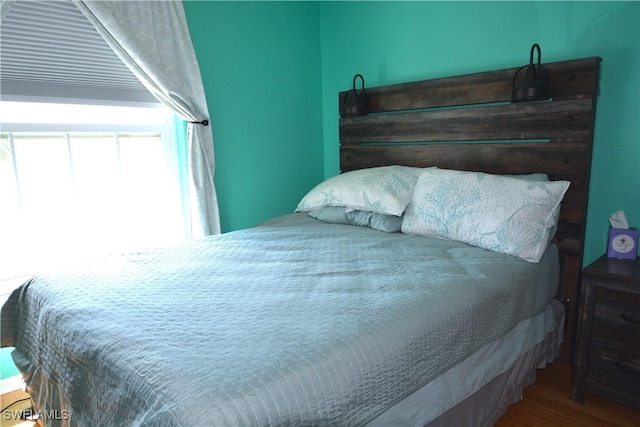 bedroom with wood finished floors