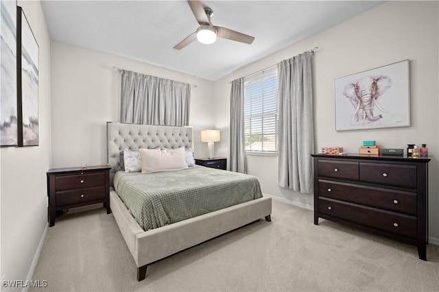 carpeted bedroom featuring a ceiling fan and baseboards