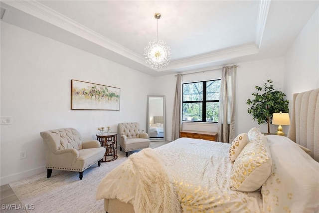 bedroom with a chandelier, ornamental molding, a raised ceiling, and baseboards