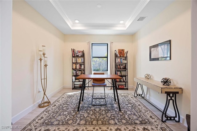 office with baseboards, visible vents, a raised ceiling, crown molding, and recessed lighting