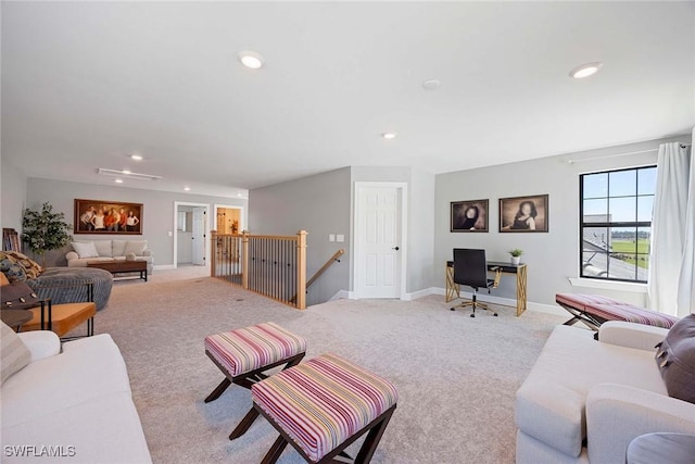 living room featuring baseboards, carpet floors, and recessed lighting