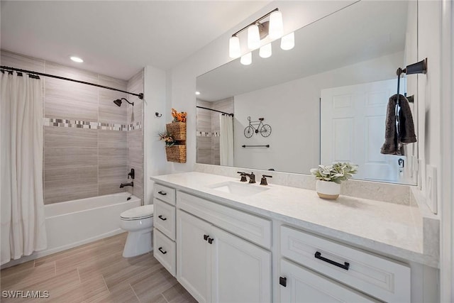 bathroom with toilet, shower / bath combo, and vanity