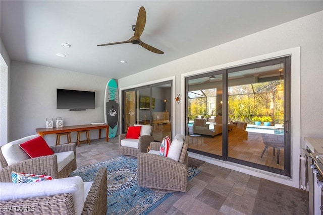 interior space featuring a sunroom and a ceiling fan