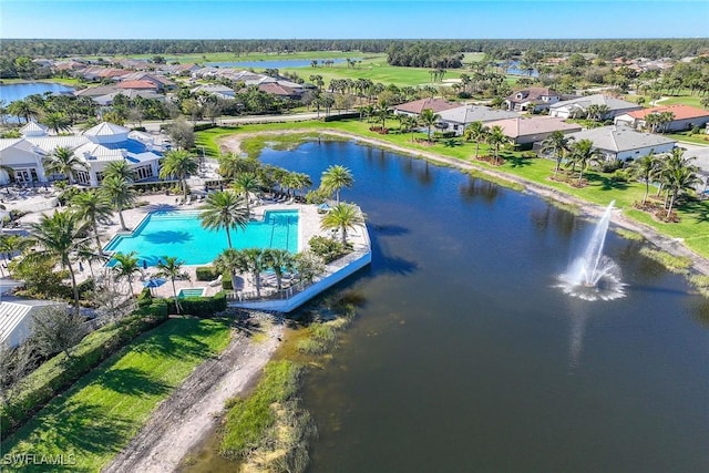 birds eye view of property with a residential view and a water view