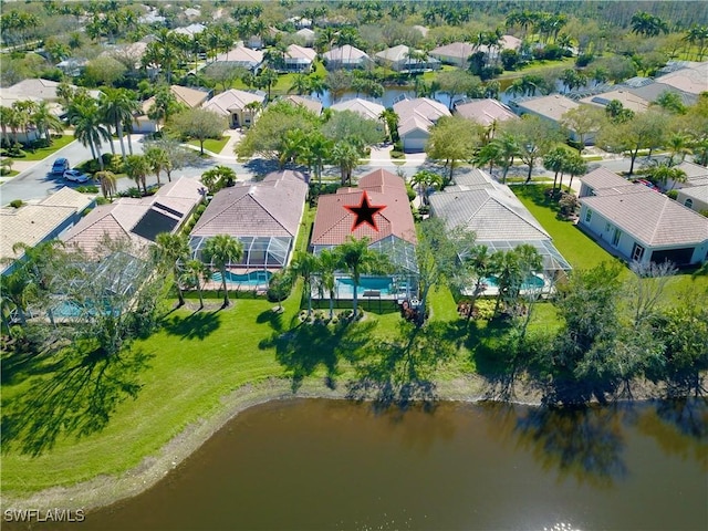 birds eye view of property featuring a water view and a residential view