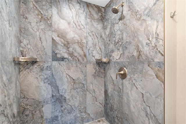 room details with a marble finish shower