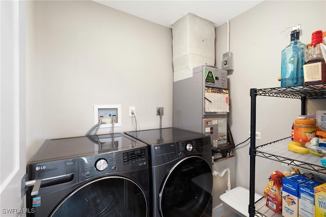 washroom featuring laundry area and separate washer and dryer