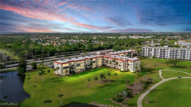 aerial view at dusk with a water view