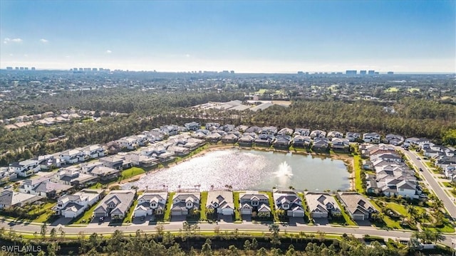 drone / aerial view with a water view and a residential view