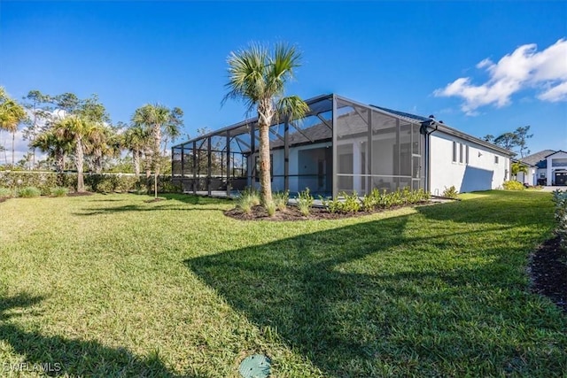 view of yard featuring glass enclosure