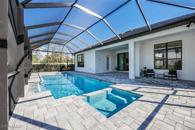 view of pool featuring a pool with connected hot tub and a patio