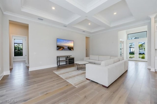 living area with light wood-style flooring, beam ceiling, coffered ceiling, and a wealth of natural light