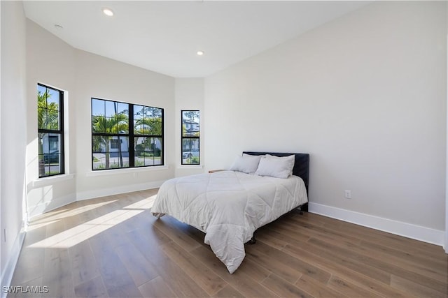 bedroom featuring recessed lighting, baseboards, and wood finished floors