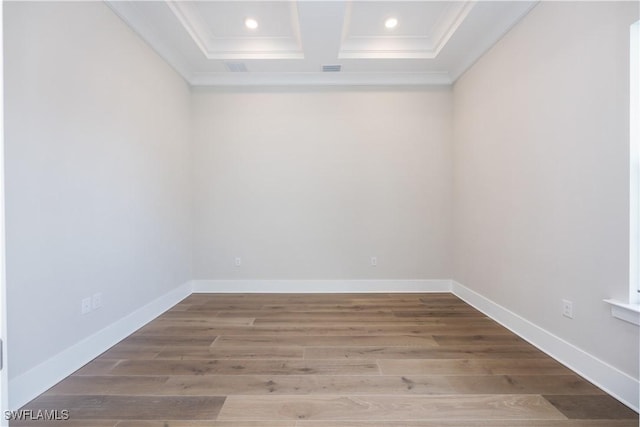 spare room featuring ornamental molding, recessed lighting, baseboards, and wood finished floors