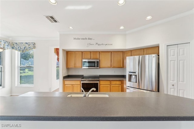 kitchen featuring stainless steel appliances, a sink, visible vents, ornamental molding, and dark countertops