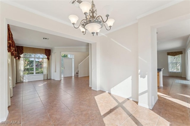 tiled empty room with stairway, visible vents, ornamental molding, and a notable chandelier